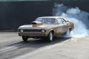 Gold NOVA Drag Car Doing Burnout